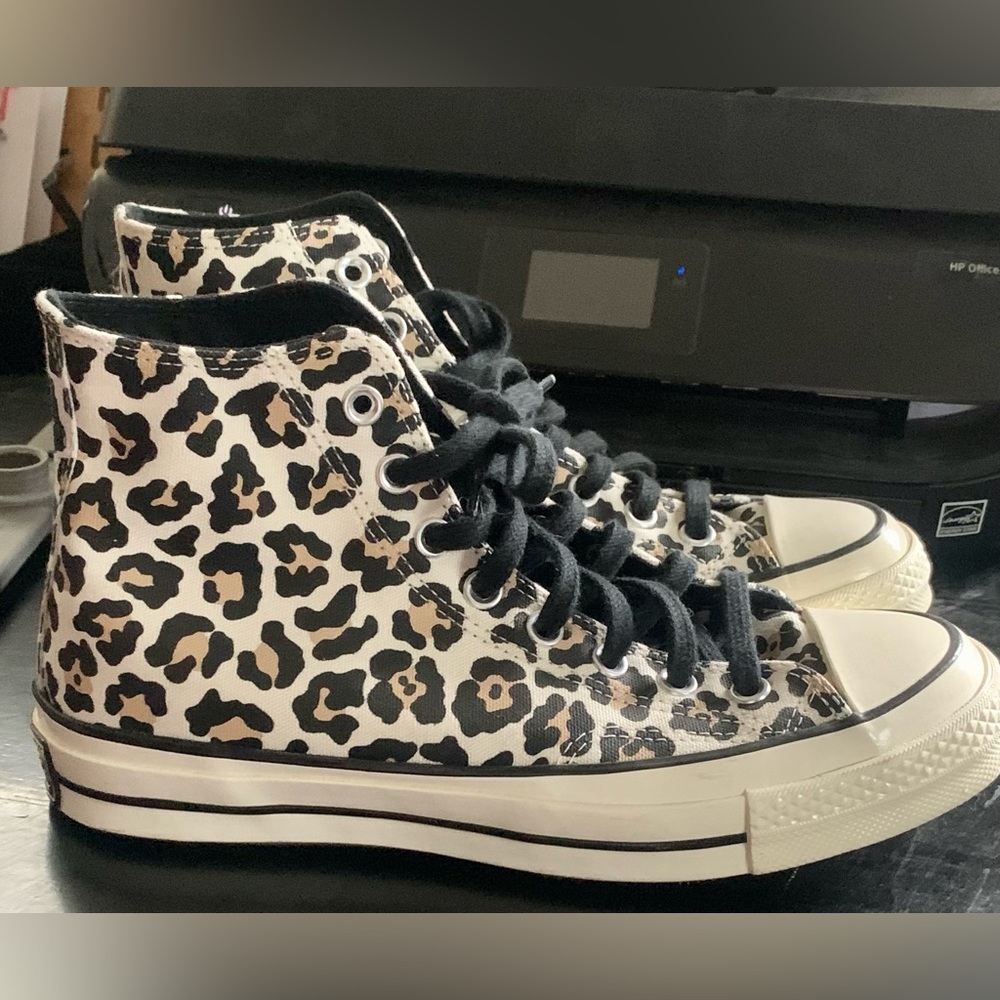 Practically brand new Converse high tops with an animal print